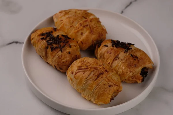 delicious croissants with chocolate and sesame seeds