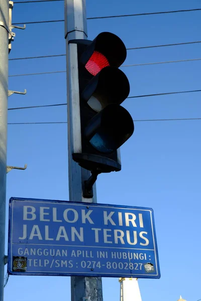 traffic light and road sign in the Indonesian city