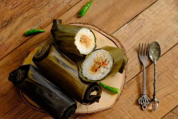 stock image Arem-arem is traditional Indonesian food made from savory rice with beef, chicken, or tempeh filling. Indonesian food. Served with bamboo steamer. food from Yogyakarta