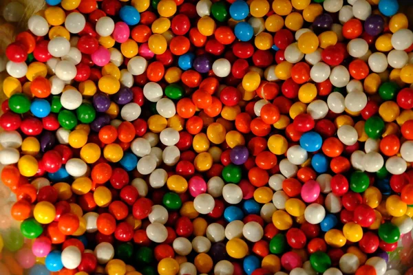 Colorful sweet candies on background, close up