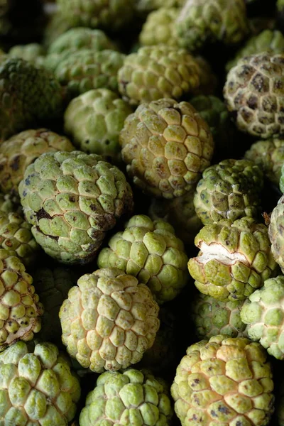Srikaya or Sugar Apples, belonging to the genus Annona which originates from the tropics. Srikaya fruit is round with skin with many eyes. The flesh is white. Annona squamosa. Stack of fruits