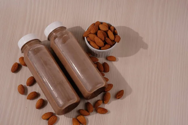 Chocolate flavored almond milk in  plastic bottles. made from almonds, chocolate, water and sugar. suitable for vegetarians and vegans as well as people who are allergic to cow\'s milk.
