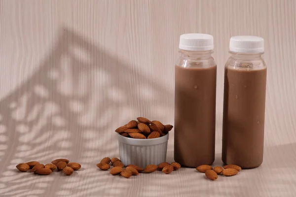 Chocolate flavored almond milk in  plastic bottles. made from almonds, chocolate, water and sugar. suitable for vegetarians and vegans as well as people who are allergic to cow\'s milk.