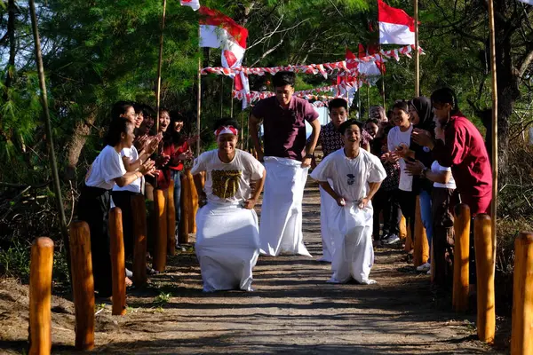 stock image Yogya, Indonesia. August 13, 2023. Lomba Balap Karung or Sack race competition is a competition in commemoration of Indonesia's independence day. students take part in the August 17 competition.