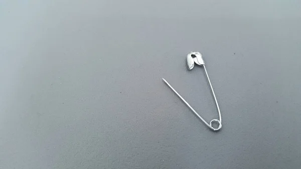 Safety Pin Grey Background — Stock Photo, Image