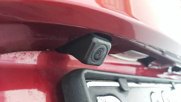 Car rear view camera or reversing camera on the red car