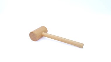 Close up of wooden hammer on white background