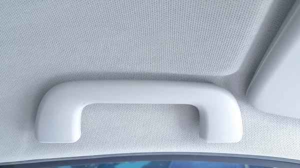 Close up of car handrail. Hand grip in car for safety