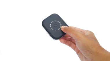 Hand holding Wi-Fi mobile router isolated on white background. Black pocket wifi.