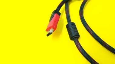 HDMI cable connector on yellow background