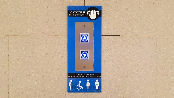 Elevator Button up and down direction. Contactless lift button with sign of priority people. elderly, disabled, pregnant woman, and person with children and infant.