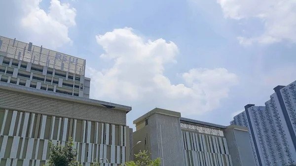 stock image Depok, Indonesia - March 18, 2023: UI hospital building with clear blue sky. University of Indonesia hospital (RSUI).