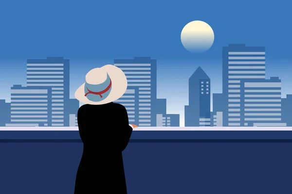 美丽的女人背对着阳台上的城市灯光站着 一个戴着帽子矢量图解的女人 — 图库矢量图片