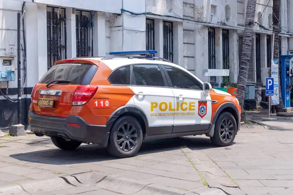 stock image Jakarta, Indonesia - August 18, 2024: An Indonesian police car for vital object protection service parked at the tourist attraction of Kota Tua Jakarta or Jakarta old town.