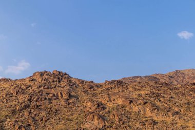 Rocky hills with clear blue sky in Mecca, Saudi Arabia clipart