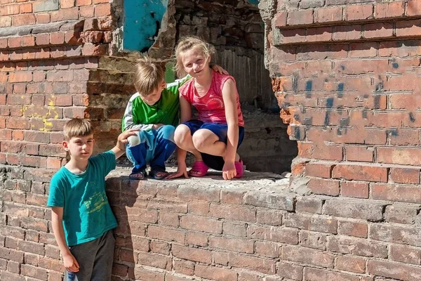 Three children in a destroyed house are hiding from military conflicts, refugee children have suffered from the destruction of terrorist acts of violence. Submission photo.