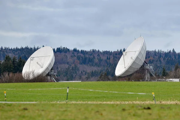 parabolic radio and television antennas for receiving satellite signals.