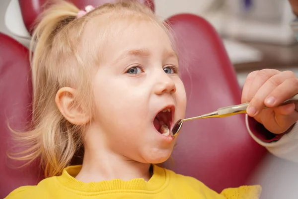 Girl Sitting Dental Chair Doctor Performs Various Manipulations Child Oral — Zdjęcie stockowe