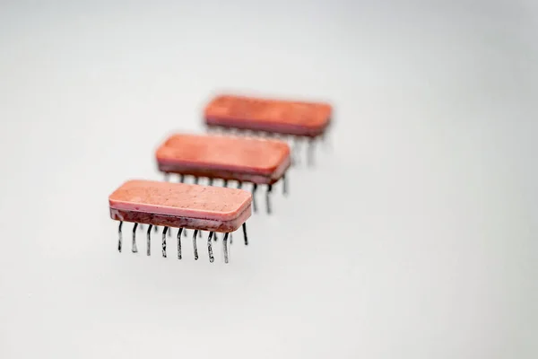 An old-style microcircuit soldered from the board. High quality photo