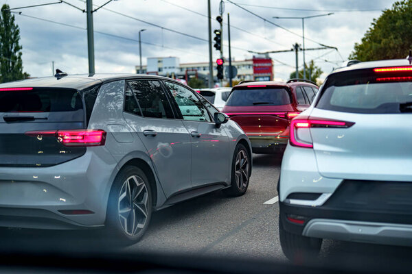Cars move along the road.