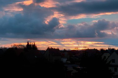 Evening sunbeams over residential area in Germany.