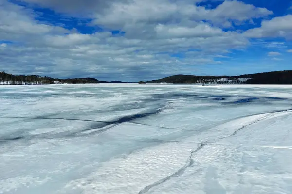 Frozen lake in northern Sweden during late winter.