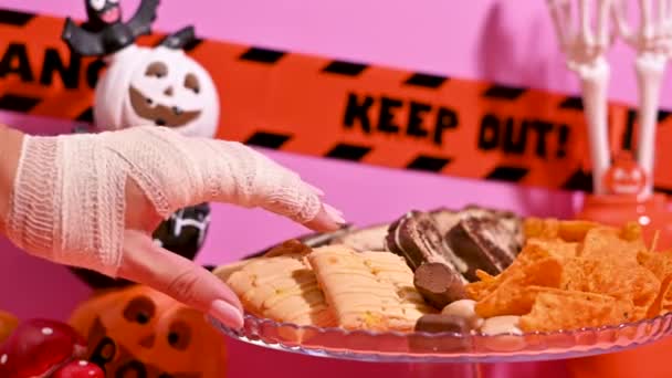 Creepy Halloween Moment Hand Bandage Picks One Candy Table — Stock Video