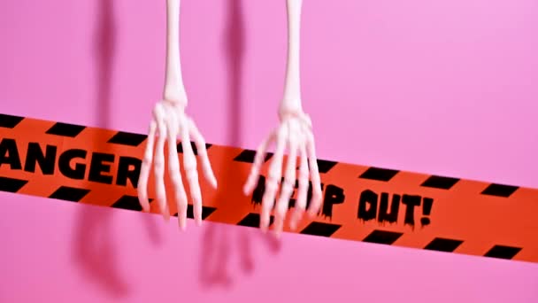Spooky Halloween Decor Hanging Skeleton Hands Pastel Pink — Stock Video