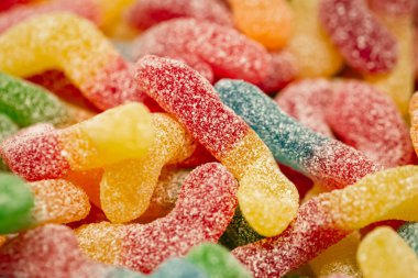 Candy background, chewing jelly candies in the form of worms, close-up.