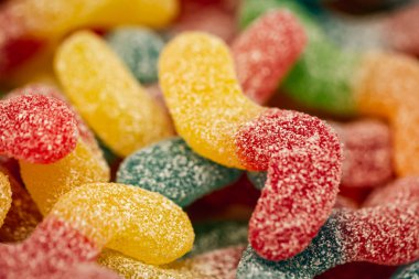 Candy background, chewing jelly candies in the form of worms, close-up.