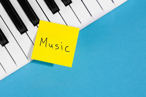 Piano Keys Yellow Paper Reminder Handwritten Lettering Music Blue Background — Stock Photo, Image