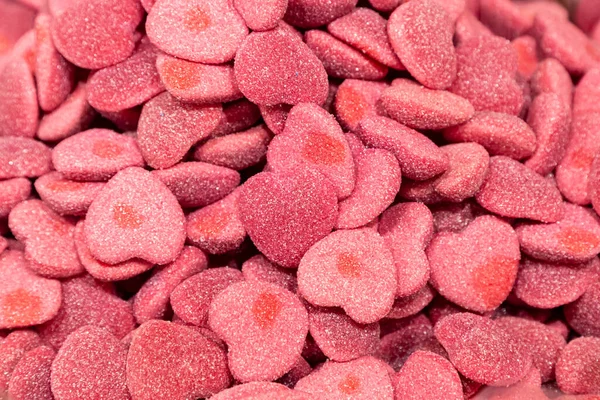 具有糖衣的红心粉状胶原蛋白的背景 — 图库照片