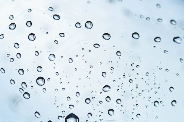 Abstract background, water drops in a plastic bottle, macro shot, selective focus.