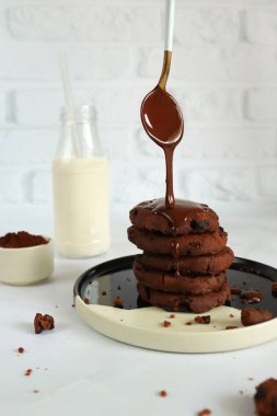 Chocolate chip cookies with chocolate chips and milk