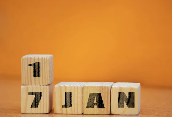 stock image Cube shape calendar for January 17 on wooden surface with empty space for text, new year Wooden calendar with date, January cube calendar on wooden surface with copy space.