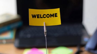 Concept of New Beautiful WELCOME written on a card at the office Business concept.