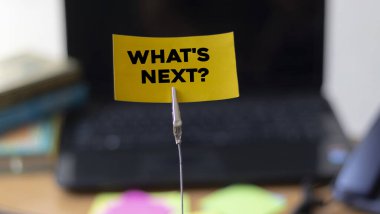 Concept of New Beautiful WHAT'S NEXT  written on a card at the office Business concept.