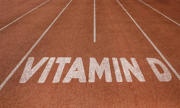 Vitamin D written on running track, New Concept on running track text in white color