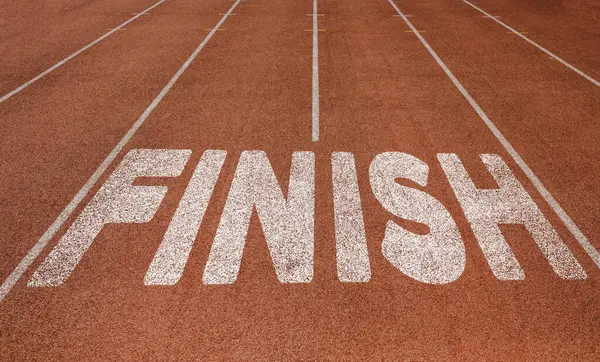 stock image Finish written on running track, New Concept on running track text in white color