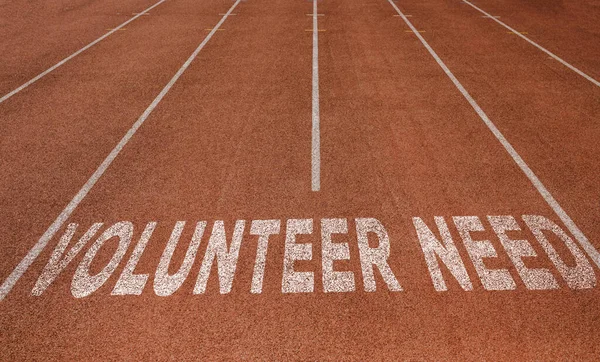 Volunteer Needed written on running track, New Concept on running track text in white colour