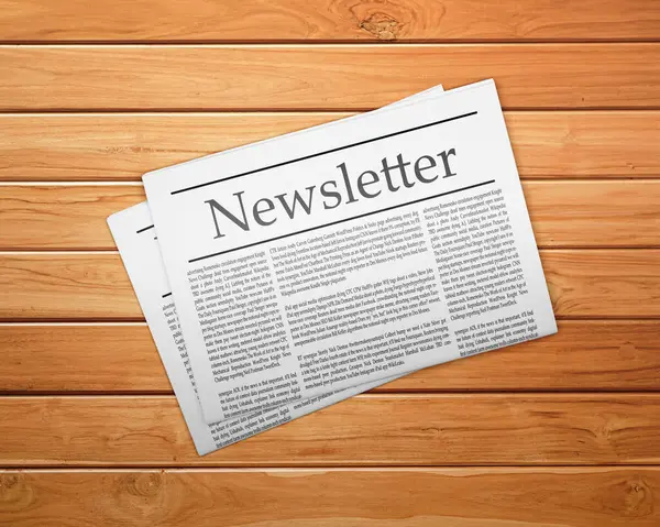 Tahta masada bir gazete, manşetli bir gazete.