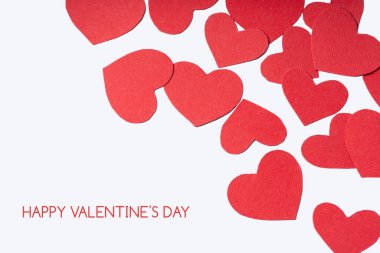 Valentine's Day. Paper hearts on a pastel background. Abstract background with paper-cut shapes. Saint Valentine