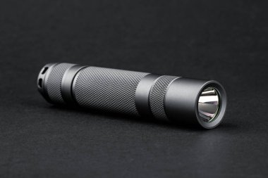 Modern aluminum LED Pocket Flashlight isolated on white background. 