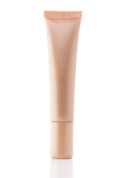 Cosmetic tube on a white background. Decorative cosmetics. A tube of foundation, concealer, liquid shadows.