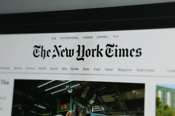 Dnipro, Ukraine 05.07.2023: The New York Times homepage on a monitor screen through. The homepage of the official website for The New York Times, an American newspaper based in New York City