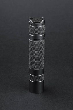 Modern aluminum LED Pocket Flashlight isolated on white background.