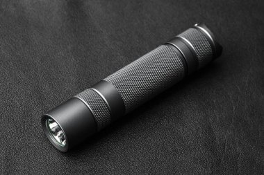 Modern aluminum LED Pocket Flashlight isolated on white background.