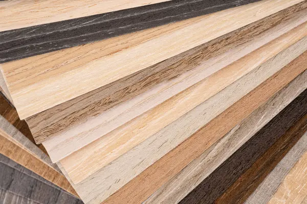 Palette of wood decor samples with different colours and textures. Sample of wood chipboard. Wooden laminate veneer material for interior architecture and construction or furniture finishing