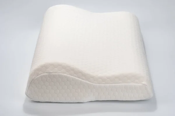 Orthopedic pillow on white background. Physiotherapy concept. Soft comfortable pillow. Orthopedic pillow, memory foam. Mattress that supported you to sleep well all night isolated on white background.