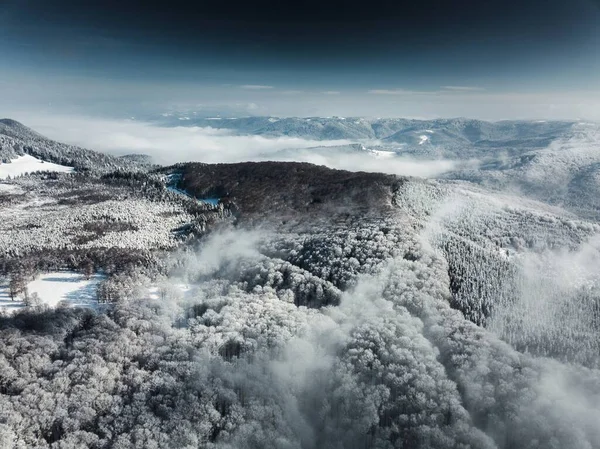 beautiful mountain scenery with fog and cloudy sky
